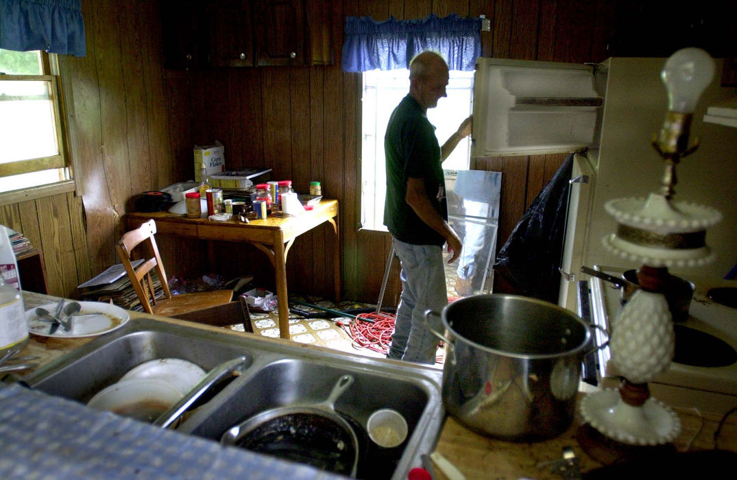 Third Place, Photographer of the Year - Michael E. Keating / Cincinnati EnquirerOften there is little to eat in Pete's refrigerator.  The squalor that is the home for Pete sometimes is overwhelming to visitors but he seldom sees anything wrong with his position in life.