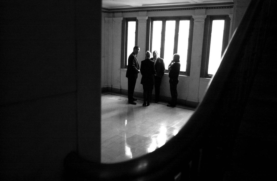 Third Place, Photographer of the Year - Michael E. Keating / Cincinnati EnquirerAs the jury deliberates the Jorg defense team and he and his wife hold a private conversation in the stairwell of the courthouse. They hope for justice in the form of acquittal.