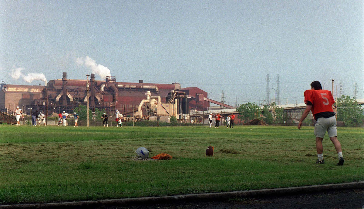 First Place, Photographer of the Year - Mike Levy / The Plain DealerThe semi pro football team, the Cleveland Panthers practice in the shadow of the west plants of LTV.