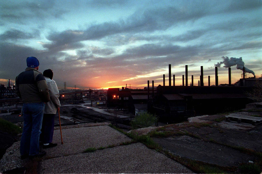 First Place, Photographer of the Year - Mike Levy / The Plain DealerA neighborhood couple completes their routine, watching the sun set over LTV.