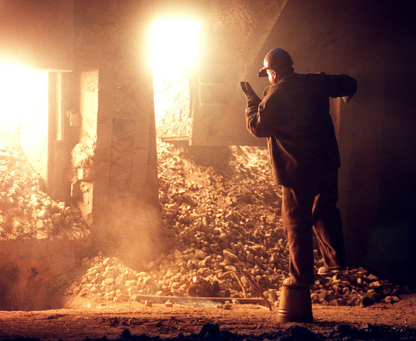 First Place, Photographer of the Year - Mike Levy / The Plain DealerA steel worker inside the Martin Furnace stands on a bucket to get a better view.