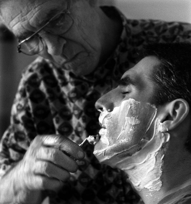 Second Place, Photographer of the Year - Steven M. Herppich / Cincinnati EnquirerErvin Enzweiler shaves Kent each day at the Drake Rehabilitation Center. While training for his first triathlon earlier this year Kent was hit by a car. He suffered massive injuries including brain and spine damage.