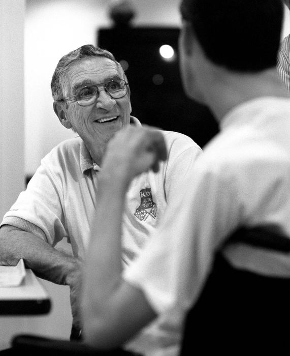 Second Place, Photographer of the Year - Steven M. Herppich / Cincinnati EnquirerErvin Enzweiler and his son Kent share a joke during dinner at the Drake Rehabilitation Center. While training for his first triathlon on March 11th of this year Kent was hit by a car. He suffered massive injuries including brain and spine damage. Ervin, who has been retired for the past 18 years, takes care of his 35-year-old son each day along with the help of a large support group of family and the friends Kent has made in the running community in Cincinnati.