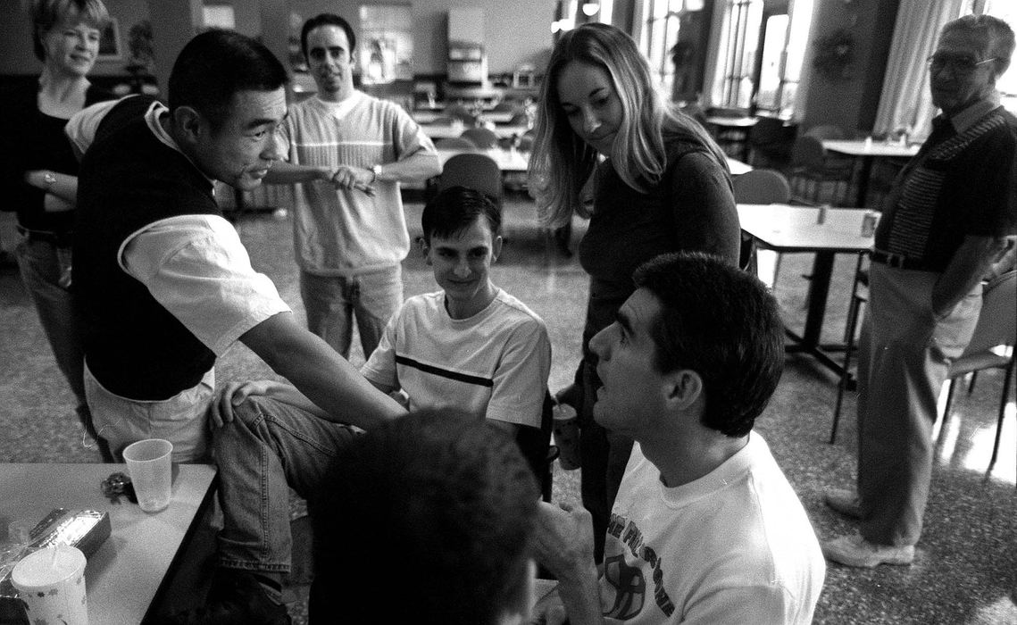 Second Place, Photographer of the Year - Steven M. Herppich / Cincinnati EnquirerKent Enzweiler, of Mount Lookout, celebrates his 35th birthday at the Drake Rehabilitation Center with friends he has made since running marathons. Joe Fung, of Glendale, John Camele, of Hyde Park, Eric McBride, of Norwood, and Cathy Brewer, of Sharonville, came out to help Kent celebrate his birthday. While training for his first triathlon earlier this year Kent was hit by a car. He suffered massive injuries including brain and spine damage.