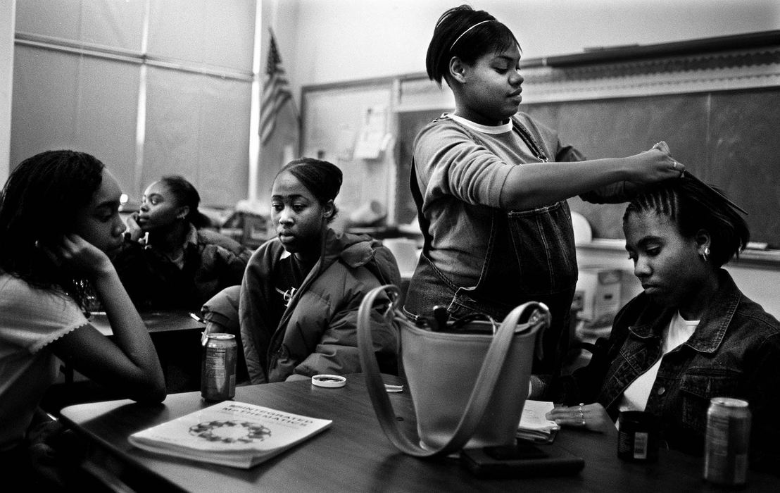 Second Place, Photographer of the Year - Steven M. Herppich / Cincinnati EnquirerLunchtime Beautician-Yolanda Battles, who is 8-months pregnant, does Ronneka Gaine's hair in Mr. Solomon's math classroom during lunch at Robert A. Taft High School in the West End.