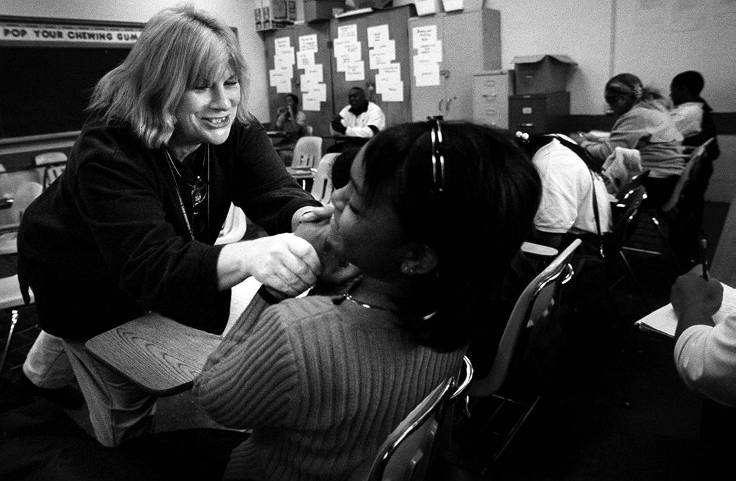 Second Place, Photographer of the Year - Steven M. Herppich / Cincinnati EnquirerSandy Houck tries to get Denise Duskin to do her work during English class at Robert A. Taft High School in the West End. Sandy Houck's 9th/10th grade English class is for students who failed 9th grade English and need to pass this class to get credit for both years. 