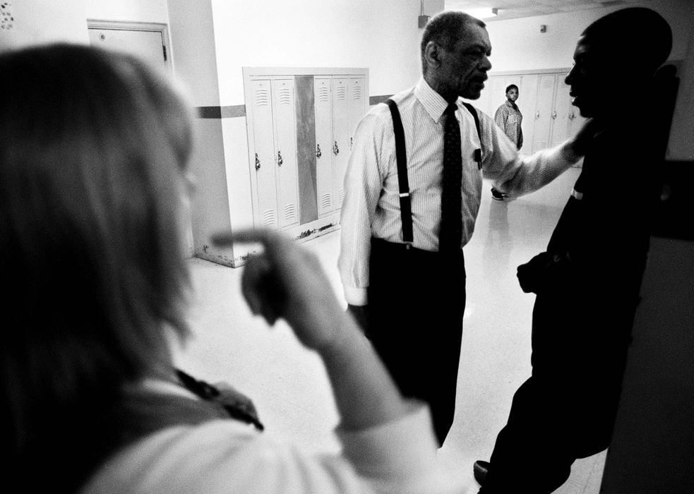 Second Place, Photographer of the Year - Steven M. Herppich / Cincinnati EnquirerTeachers Ms. Houck and Mr. Solomon try to get Maurice Brewster into his classroom after a disruption in the hallway at Robert A. Taft High School in the West End. Maurice is in Sandy Houck's 9th/10th grade English class. Students in this class failed 9th grade English and need to pass this class to get credit for both years. 