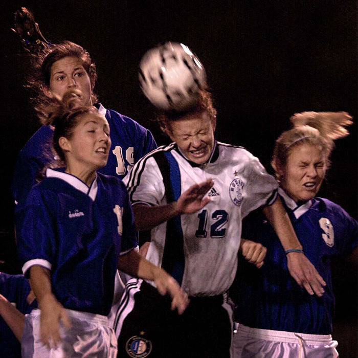 First Place, Photographer of the Year - Mike Levy / The Plain DealerHeads are up during girls high school regional soccer action.