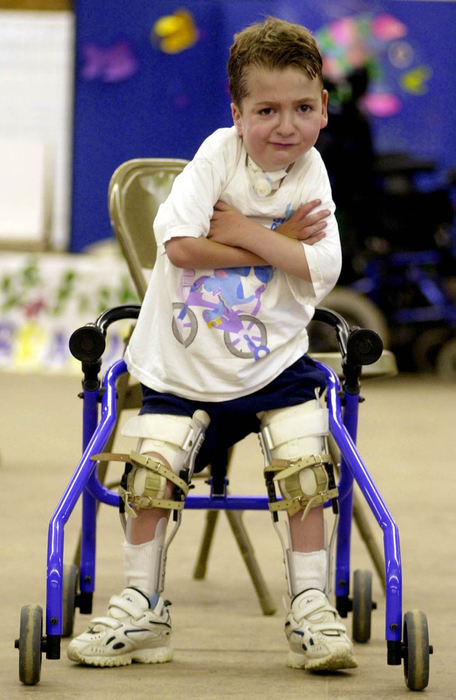 Award of Excellence, Portrait/Personality - Ken Blaze / News-HeraldLucas Cox, 6, of Kirtland, pauses as he practices his walking during camp at the Hiram House Camp in Moreland Hills. Lucas suffers from a muscle and skeletal disease and must use a ventilator during the night.