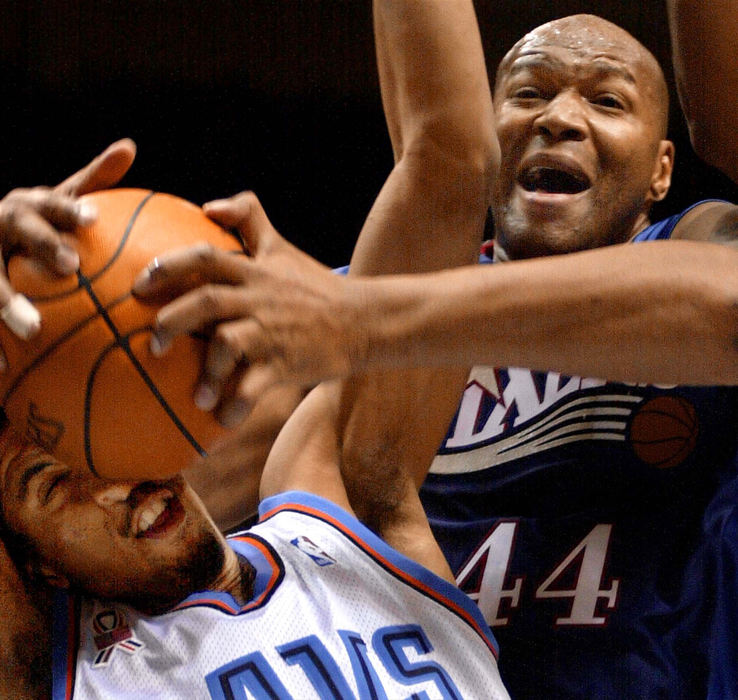 First Place, Sports Action - Joh Kuntz / The Plain DealerCleveland Cavaliers guard Andre Miller is hit in the face by as he fights for a rebound against the Philadelphia 76ers Derrick Coleman in the second period December 15, 2001 at Gund Arena.  