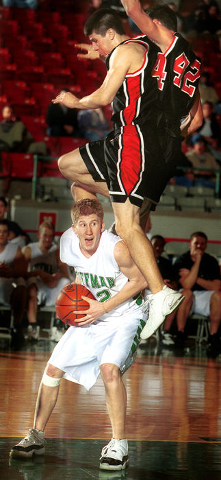 Award of Excellence, Sports Action - Joe Maiorana / This Week NewspapersCoffman's Matt Cannan (bottom) fakes and draws a foul as Groveport's Eric Smith and Kyle Wolfe defend.