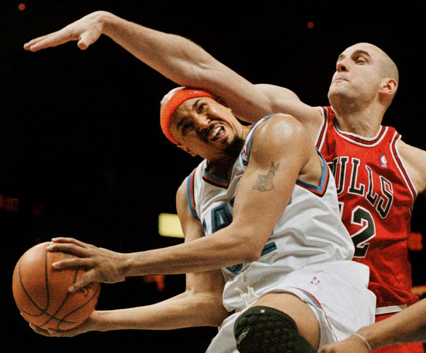 Award of Excellence, Sports Action - Ron Kuntz / ReutersA flagrant foul was called on Dragan Tarlac, of the Chicago Bulls, as Chris Gatling, of the Cleveland Cavaliers, attempts a shot during the 4th quarter of game at Gund Arena in Cleveland.             