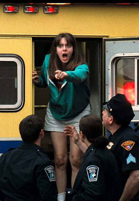 Third Place, Spot News Large Market - Mike Levy / The Plain DealerAfter learning that her 7-year-old son, Vincent, had been struck and killed by an RTA Rapid train, Claudia Pannetti screams as attendants from the coroner's office remove the boy's body.