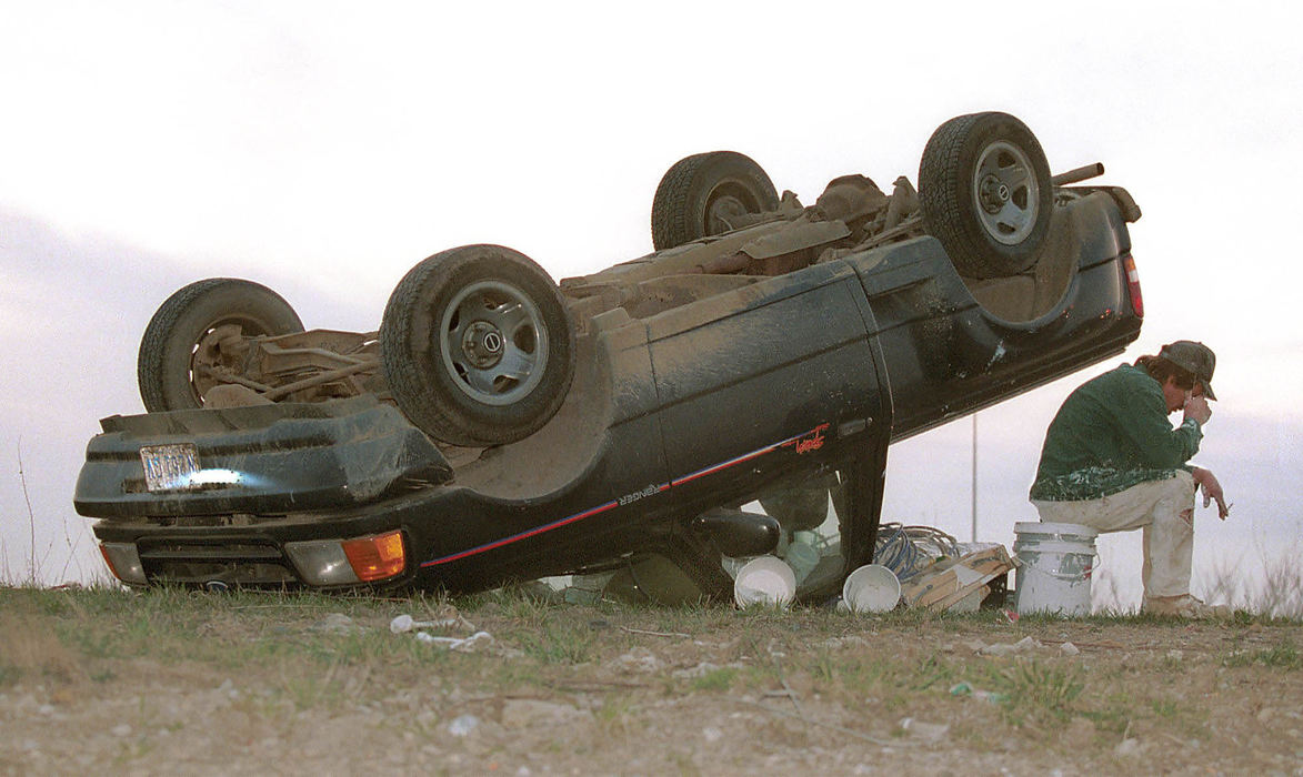 Award of Excellence, Spot News Small Market - Joe Maiorana / ThisWeek NewspapersColumbus resident John Alton is shaken up after his Ford Ranger was cut-off while merging off of I-270, causing the vehicle to flip and come to rest on its' top on the side of the off ramp to 71 South.