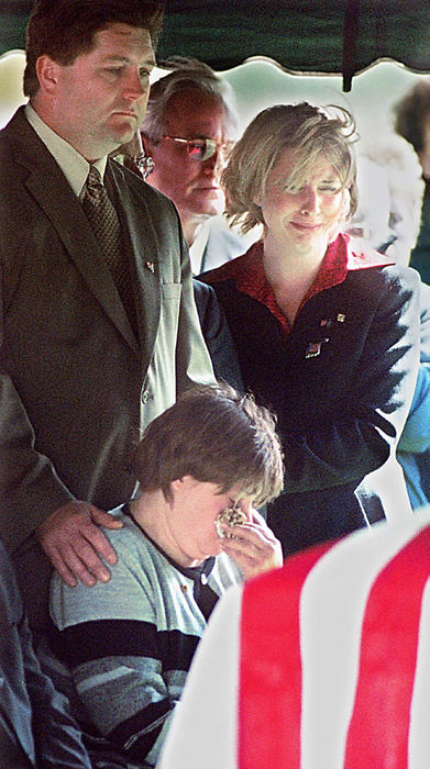 Second Place, Student Photographer of the Year - Greg Ruffing / Kent State UniversityFamily members of Army Commander William Ruth grieve over his flag-draped coffin during his funeral in Alliance. Ruth worked in the Pentagon and was killed in the September 11 terrorist attacks on the United States.