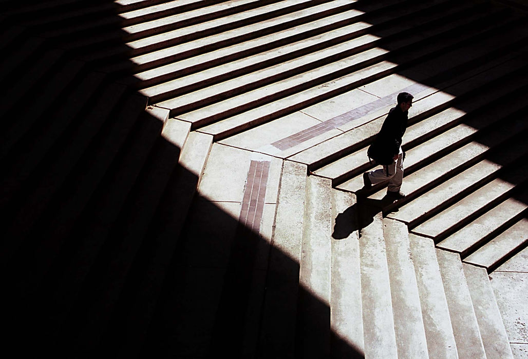 Second Place, Student Photographer of the Year - Greg Ruffing / Kent State UniversityA student descends a patch of sunlit stairs on his way into the law building on the University of Pittsburgh campus.