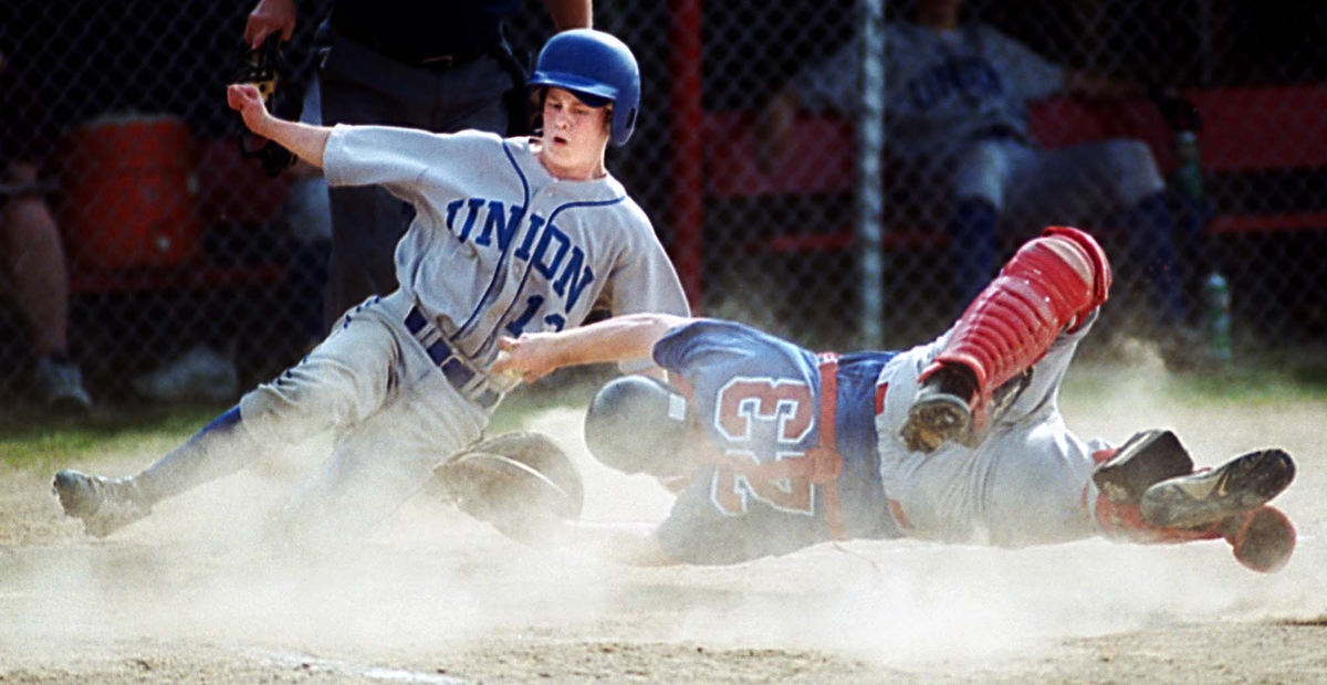 Second Place, Student Photographer of the Year - Greg Ruffing / Kent State UniversityDespite a diving tag attempt by Monaca (Pa.) High School catcher Billy Marshall, Union (Pa.) High School's Jimmy Cox scores a run in the fifth inning of Monaca's 8-3 victory.