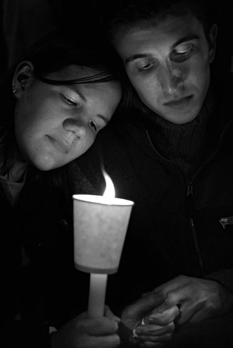 First Place, Student Photographer of the Year - David Distelhorst / Ohio UniversityKara Bauman (left) and Kory Crabtree participate in a candlelight vigil on the steps of the Athens County Courthouse, October 8, 2001 to honor victims of hate crimes and those who have taken their own lives due to the effects of anti-gay discrimination.