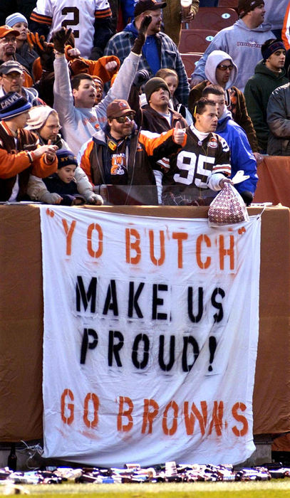 First Place, Sports Picture Story - Scott Heckel / The RepositoryFans react in the Dawg Pound as the Jacksonville Jaguars and the Cleveland Browns prepare for the final two plays of the game. Bottled that once littered the paying field were collected and pushed to the edge of the stands by game-day personnel.