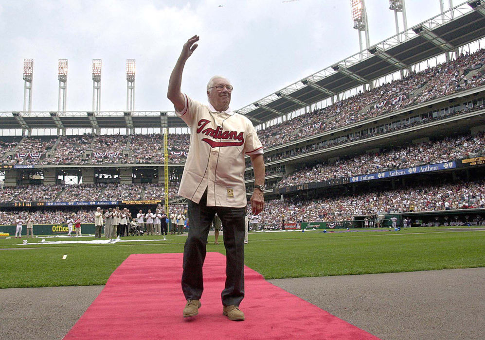 Second Place, Sports Picture Story - Chuck Crow / The Plain DealerIn the 100th  Anniversary of the Cleveland Indians baseball team, the Tribe put together a blend of veteran players and some young pitchers to reach the World Series, something they haven't won since 1948.  Through the highs and lows, the celebrations, inclement Cleveland spring weather and the terrorist attacks on the World Trade Centers, the Indians gave their fans a season to remember and to reflect, as always, on next year. The greatest Indian pitcher, the great Bob Feller, waves to fans  at Jacobs Field.                                                                           