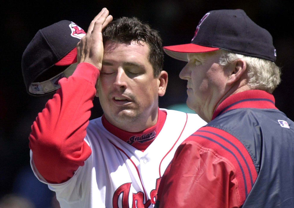 Second Place, Sports Picture Story - Chuck Crow / The Plain DealerThe Indian's old arms on the starting pitching staff started to fade early in the 2001 campaign.  Starting pitcher Dave Burba is pulled in the 4th inning in the game against the Tampa Bay Devil Rays. Burba was losing 5-0 and his expression here sums up the day.  Manager Charlie Manuel stands by his pitcher.   