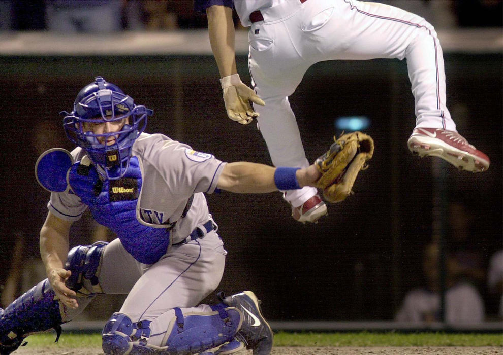 Second Place, Sports Picture Story - Chuck Crow / The Plain DealerKansas City catcher Gregg Zaun gets nothing but air as Cleveland Indians' Roberto Alomar scored in the 5th inning.  This made the score 5-1. The Tribe scored 7 runs in the 5th inning and went on to win the game.