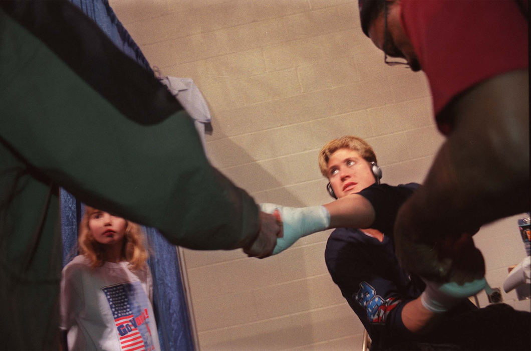 Third Place, Sports Picture Story - Gus Chan / The Plain DealerVonda Ward gets a good luck handshake from the producer of ESPN II's Friday Night Fights  before fighting in Columbus February 2, 2001. 