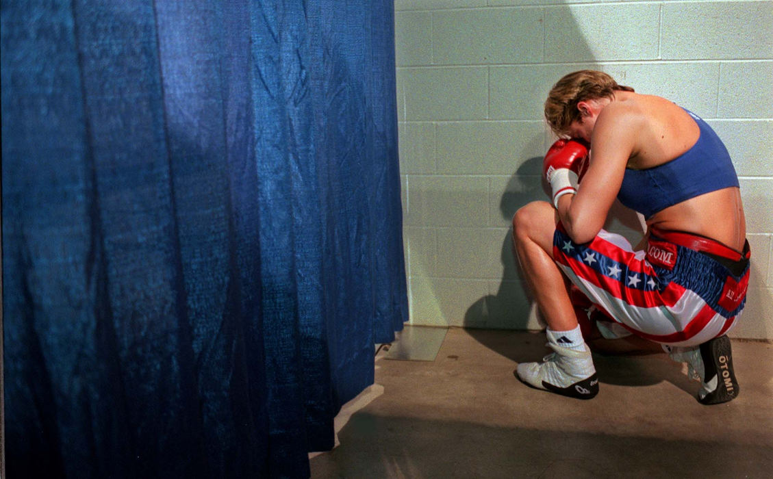 Third Place, Sports Picture Story - Gus Chan / The Plain DealerA quiet corner gives Vonda Ward a place to gather her thoughts and say a short prayer before her bout with Kisha Snow Friday, February 2, 2001, in Columbus.   