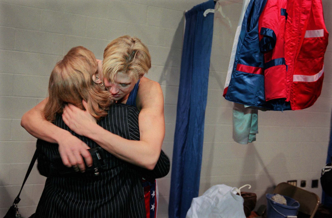 Third Place, Sports Picture Story - Gus Chan / The Plain DealerVonda Ward gets a hug from mother Roseanne after beating Kisha Ward in a fourth round TKO Friday, February 2, 2001, in Columbus. 