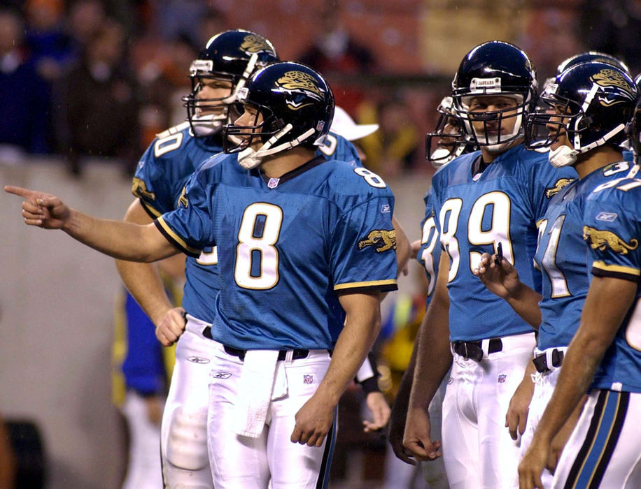 First Place, Sports Picture Story - Scott Heckel / The RepositoryJacksonville quarterback Mark Brunell points to fans in the Dawg Pound that continue to throw bottles and debris onto the field once the teams were brought back to complete the final 48 seconds of the game. Brunell knelt down for the final two plays to end the contest. 