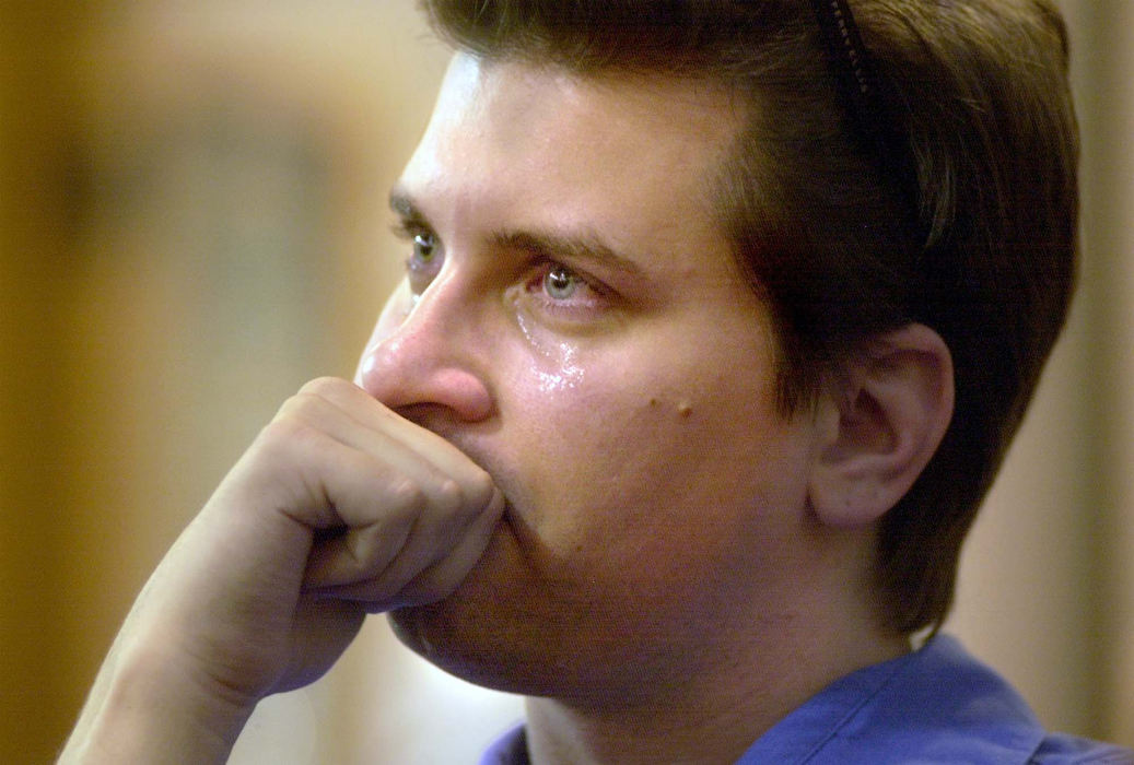 Third Place, Team Picture Story - Chris Stephens / The Plain DealerJeff Syroney weeps as he listens to a sermon during  the ecumenical prayer vigil at St. Patrick's Catholic Sept. 11.  The vigil was held in response to the attacks on the World Trade Center and the Pentagon. Mr Syroney lives in Cleveland.