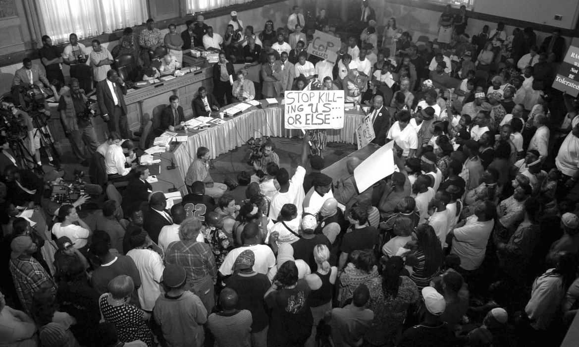 First Place, Team Picture Story -  / Cincinnati EnquirerAn angry crowd jams City of Cincinnati Council Chambers, April 9, 2001 in response to the Cincinnati Police shooting of yet another unarmed black man, Timothy Thomas in Over-the-Rhine. 