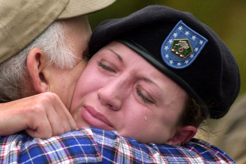 Third Place, Team Picture Story - John Kuntz / The Plain DealerStephanie Fought, a member of the 135th Military Police Company from Brook Park, weeps as she says goodbye to her father-in-law Gerald Fought on Oct. 11, 2001. Fought's company left for Fort Bragg, N.C.