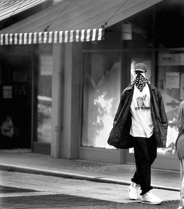 First Place, Team Picture Story -  / Cincinnati EnquirerOne of two store fronts burn on Elder in Findlay Market. Protestors rioted throughout the day after the shooting death of Timothy Thomas in Over-the-Rhine.