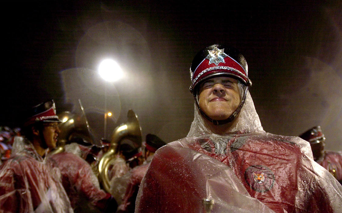 Award of Excellence, Enterprise Feature - Matt Sullivan / The Columbus DispatchCircleville High School sophomore band members Tim McCall lets the rain fall on his face September 20, 2002, prior to taking the field to entertain the crowd at halftime of their game at Fairfield Union High School.