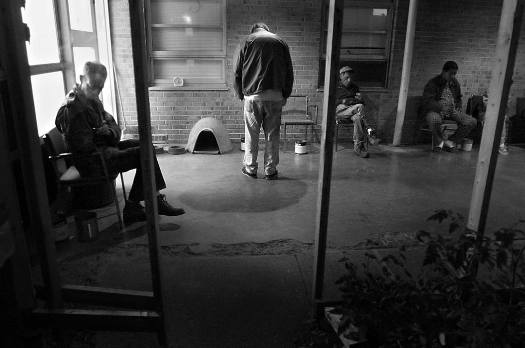 Third Place, Feature Picture Story - Greg Ruffing / Kent State UniversityBryan takes a cigarette break with other patients at a residential care center where he was involuntarily committed. For those affected by mental illness, this rehabilitation facility serves as a middle ground between a lockdown institution and independent living.  