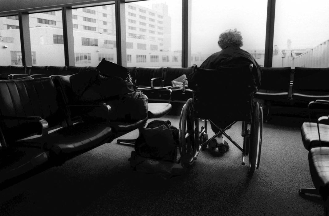 Award of Excellence, Feature Picture Story - Bill Kennedy / The Plain DealerJuney waits at Bradley International Airport in Connecticut for her plane that will take her to Ohio, leaving Holyoke, MA, where she lived most of her life. 