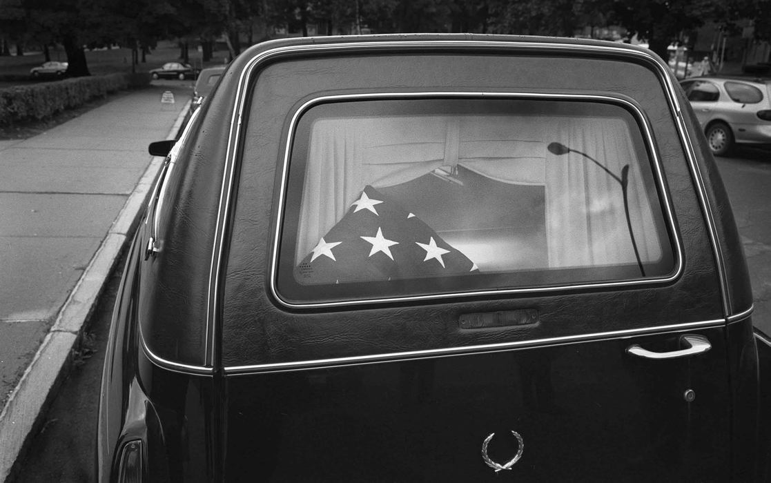 Award of Excellence, Feature Picture Story - Bill Kennedy / The Plain DealerReturning to Massachusetts for her funeral and burial in a family plot, the hearse bears not only Juney's body but a flag, signifying her military service. 