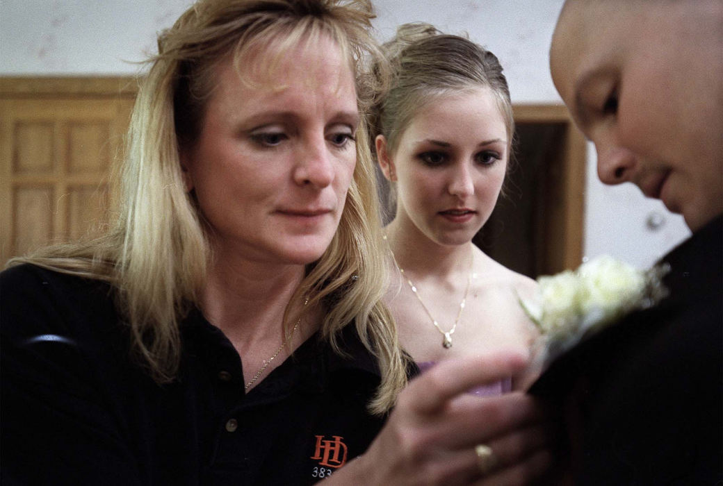 First Place, Feature Picture Story - Eustacio Humphrey / The Plain DealerKathy Allshouse (left) makes sure that her son, Justin, looks his best before he leaves for the prom with his girlfriend of two years, Chelsey Keep.