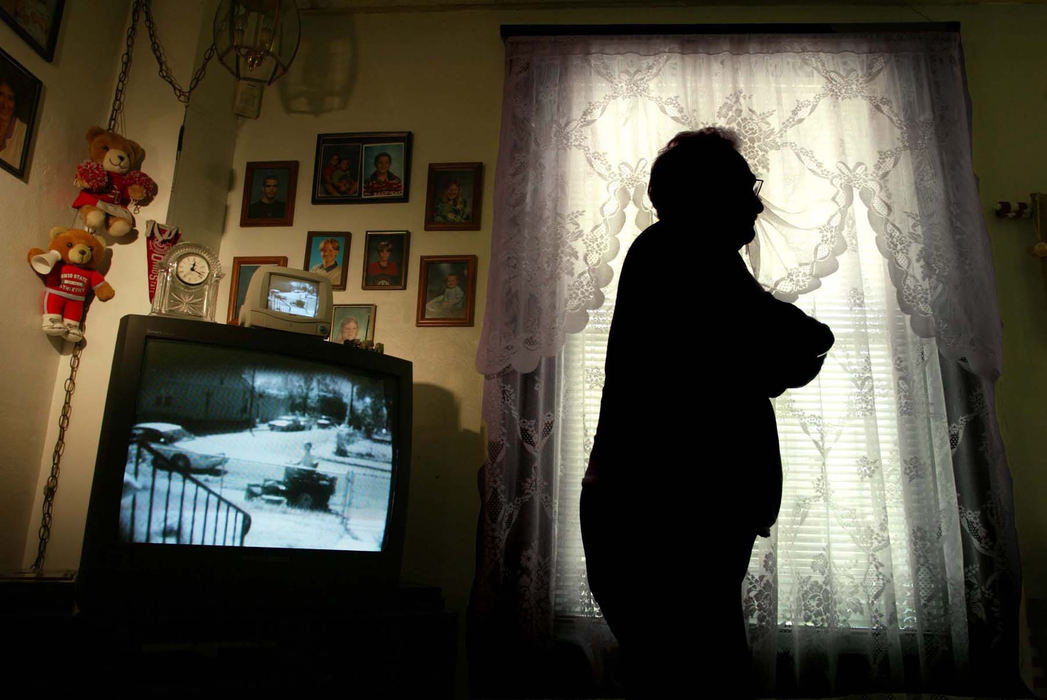 Second Place, General News - Eric Albrecht / The Columbus DispatchRon Jaynor in his house, his television is wired as a monitor to see outside on to his street. Ron is always on the lookout because the high amount of criminal activity in his neighborhood.