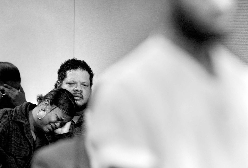 Third Place, General News - Fred Squillante / The Columbus DispatchApril Williams cries as she sits with her father, Dennis Congdon during the arraignment of Elwood Henry Jr. (right foreground) who is accused of killing his four-month-old baby that April Williams is the mother of. 