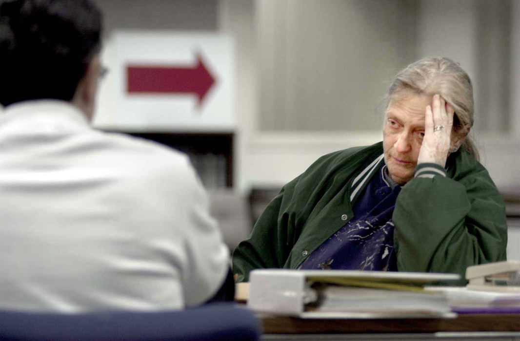 Second Place, News Picture Story - Allan Detrich / The BladeGale Rose, a Port Clinton resident, is frustrated as she talks to FEMA employee Vince Yelmini in the newly opened Disaster Relief office at 315 Madison, in the basement of the County Courthouse in Port Clinton, two weeks after the tornado.