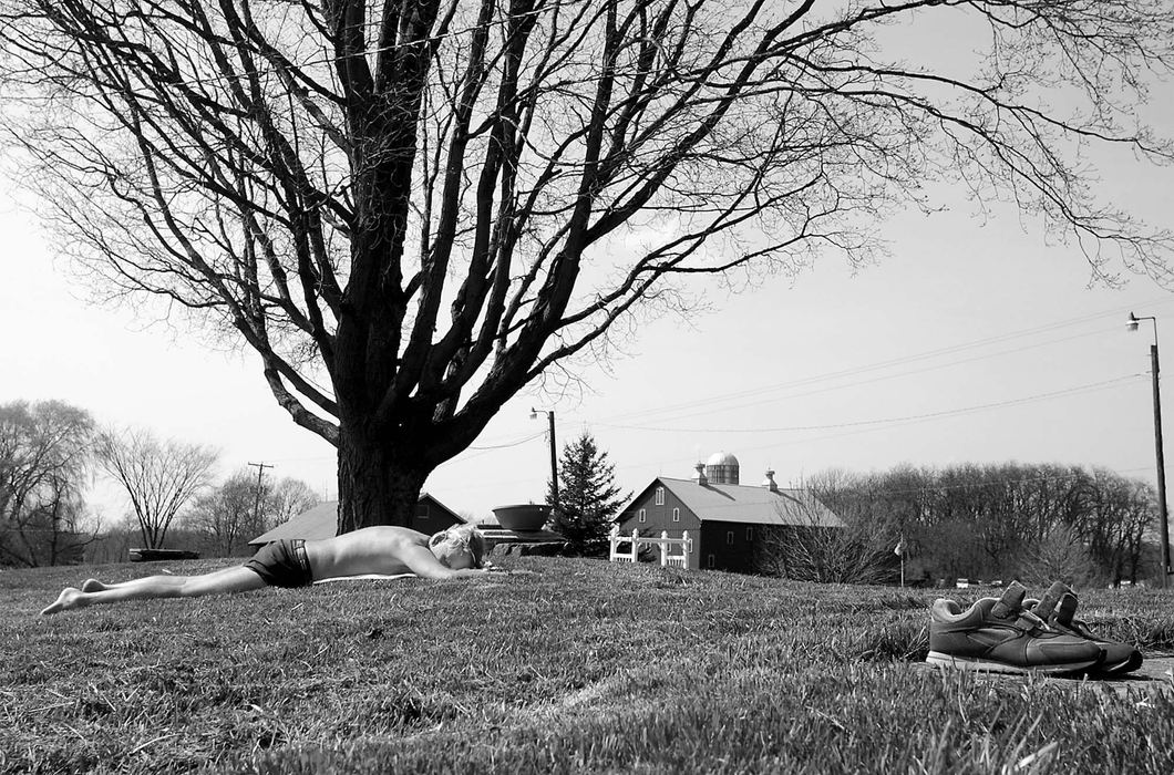 Third Place, News Picture Story - Monique Ganucheau / Medina GazetteAfter pulling weeds out of the flower beds all morning, Tim Johnson, 64, takes a nap in the sun.  Johnson has been known to forget to eat because he is busy taking care of the yard.