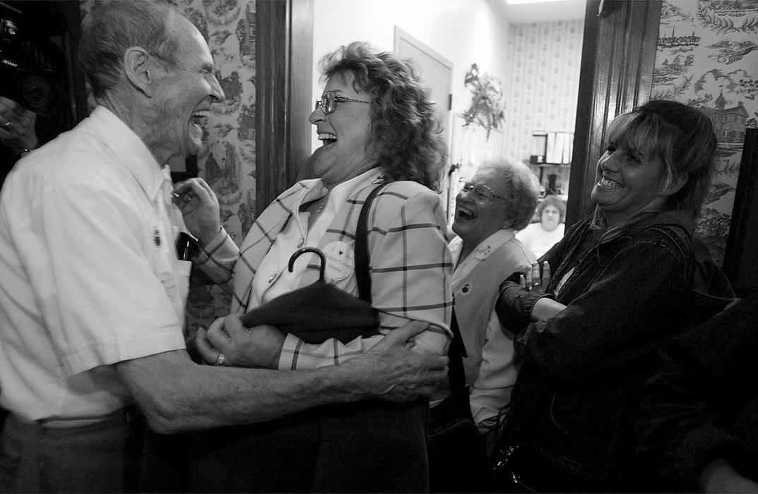 Third Place, News Picture Story - Monique Ganucheau / Medina GazetteAfter 6 months of waiting Finn Dietrichs celebrates with Lynn Remington assistant administrator a majority vote to keep the Medina County Home open.