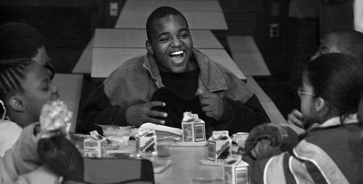 First Place, Ohio Understanding Award - Ed Suba, Jr. / Akron Beacon JournalLeroy Sutton (center) feeling a bit more relaxed in his news surroundings, shares a joke with his new schoolmates at lunch during his first day of school at Anne T. Case Elementary school in Akron.