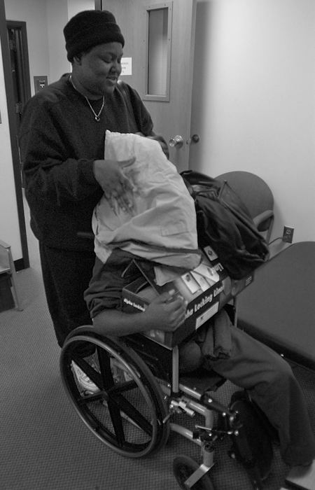 First Place, Ohio Understanding Award - Ed Suba, Jr. / Akron Beacon JournalPlayfully covering his head with a coat, Karina Sutton has some fun with her son, Leroy, as they wait to start another therapy session at Children's Hospital in Akron.