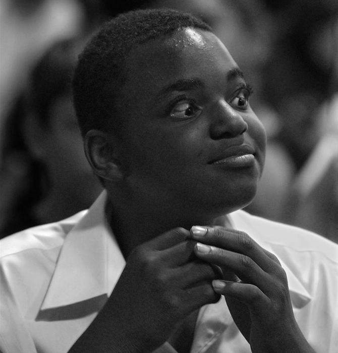 First Place, Ohio Understanding Award - Ed Suba, Jr. / Akron Beacon JournalLeroy Sutton, never one to hide his personality, flips his eyelids inside out, as he tries to get a laugh from his fellow classmates during their fifth grade graduation ceremony at Case Elementary school in Akron.