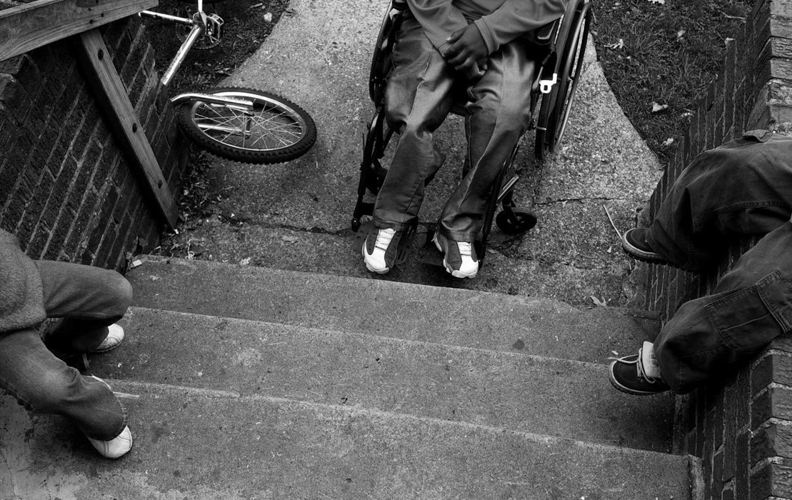 First Place, Ohio Understanding Award - Ed Suba, Jr. / Akron Beacon JournalWearing his artificial legs Leroy Sutton appears no different than any other 12-year-old boy as he hangs out in front of his Akron home with some of his neighborhood friends after school. Even though Sutton has begun to try walking with his legs using a walker, it has become a slow process for him and the family. Wearing the legs and using his wheelchair to get around will be the status quo in his life for quite some time yet.