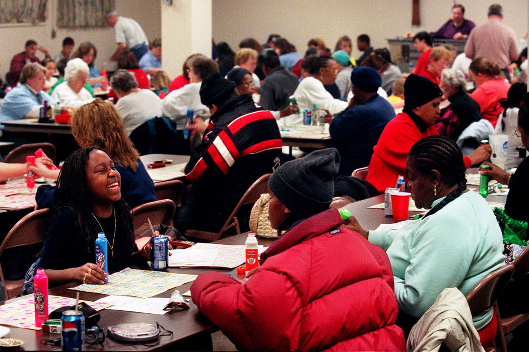 Third Place, Ohio Understanding Award - Steven M. Herppich / Cincinnati EnquirerShortly after 7 pm each Thursday night, the St. Boniface School cafeteria in Northside, a neighborhood in Cincinnati, is packed with nearly 200 people. Bingo night at St. Boniface began 35 years ago and the church relies on the weekly game for 17 percent (roughly $70,000) of the church’s schools annual budget. The people that are here each week come to unwind-and win! Shinay Copeland, of College Hill, laughs with her friend Jazzmen Colbert, of Northside, at St. Boniface Bingo.