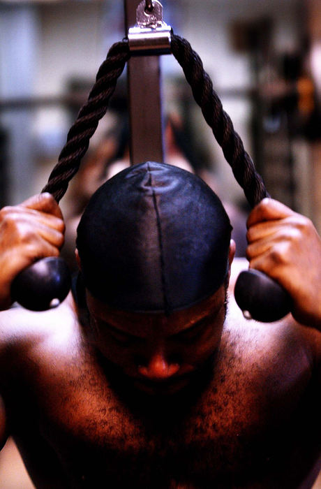 Third Place, Ohio Understanding Award - Steven M. Herppich / Cincinnati EnquirerRodrick Miller, 31, of Coleraine Township works his abdomen during a workout at the Lord's Gym on Liberty and Walnut Ave., April 4, 2002.